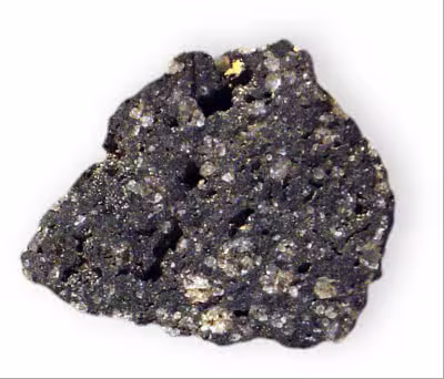 Leucite_in_rock_w-_nepheline_Potassium_aluminum_silicate_Albano_Hills_Italy_1927